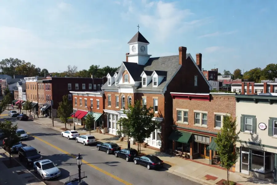 Streetscape view of downtown Phoenixville, Pennsylvania with historic brick buildings and local shops