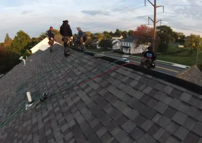 Roofing contractors on residential roof