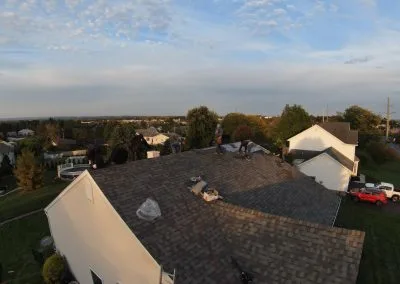 Roofing team repairing shingle roof